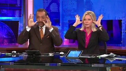 WGN-TV Anchors Robert Jordan and Jackie Bange`s commercial break handshake