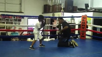 5 Year old boxer shows his skills while sparring with his father