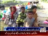 JALALPUR BHATTIAN. Flood victims wait for aid