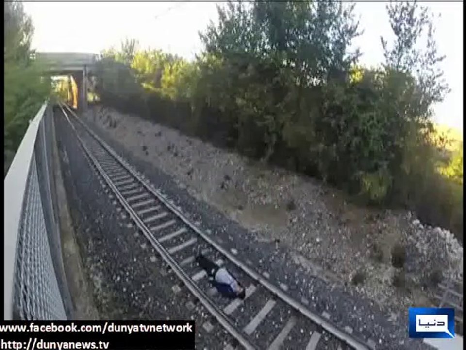 Italian teen lays between tracks and lets speeding train race over him