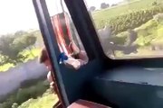 Crazy Truck driver turning aroung his truck cabin while he's driving!
