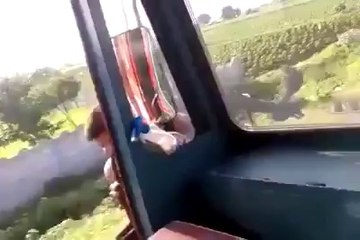 Crazy Truck driver turning aroung his truck cabin while he's driving!