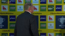 Ewen McKenzie announces resignation as Australia rugby coach in press conference.