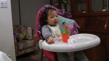 Girl Eating Broccoli