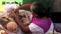 Mexico: Villagers clean SKULLS ahead of Day of the Dead