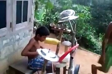 indian boy playing heavy metal drums .. kid rock