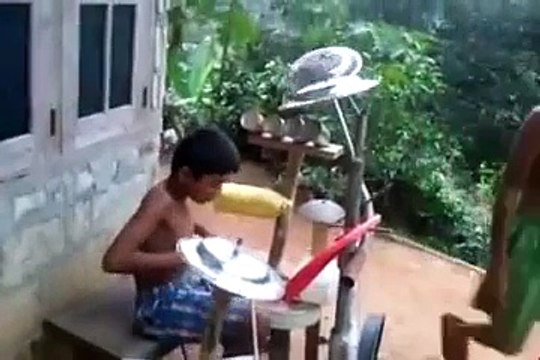 indian boy playing heavy metal drums .. kid rock