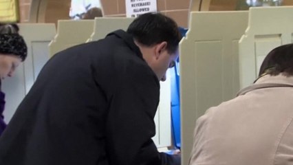 Walker and Burke cast votes in tight race for governor in Wisconsin
