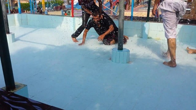 Enjoying Rainy Environment in Picnic World Water Park