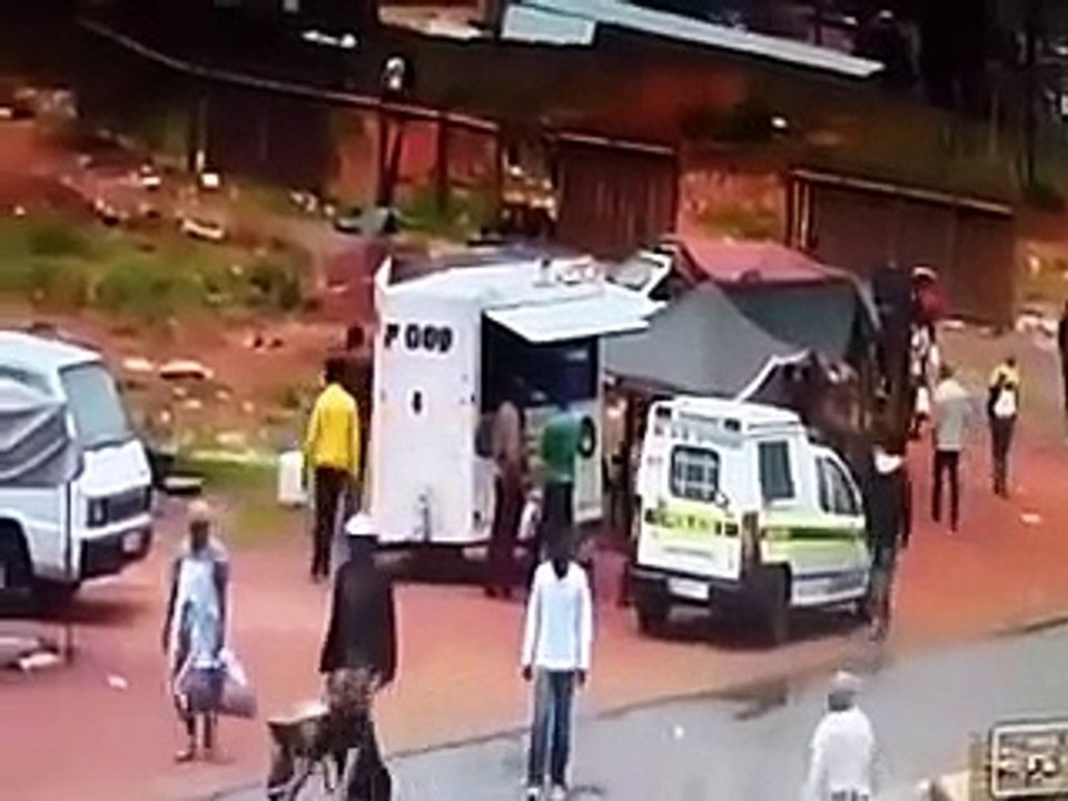 Police robbed and bundled into back of their own van while buying food