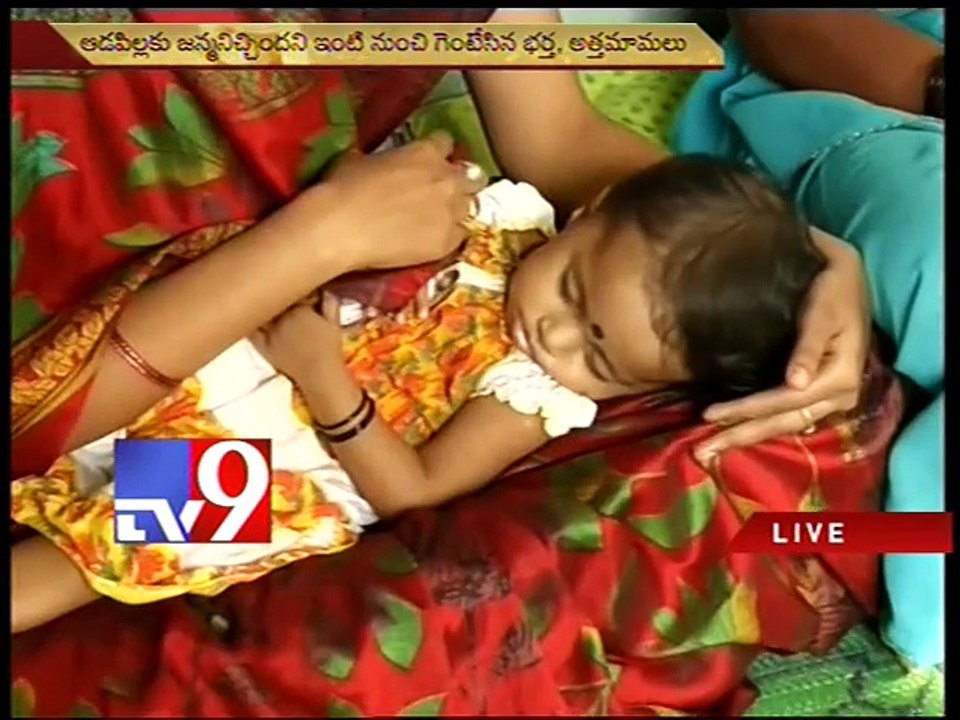 Woman accuses husband of harassment, stages dharna - Tv9