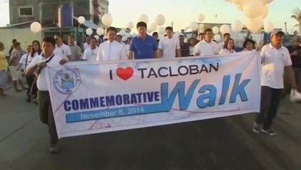 Thousands join commemorative walk to mark a year since Typhoon Haiyan hit