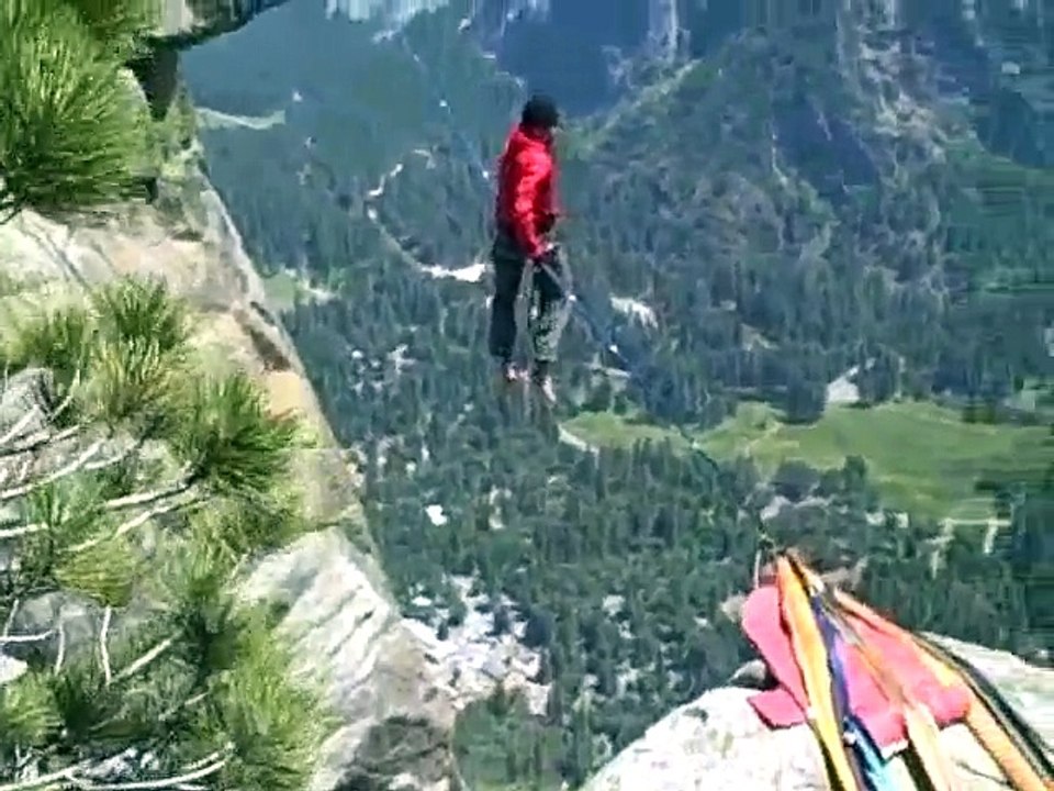 Crazy German guy walking tightrope over Yosemite falls