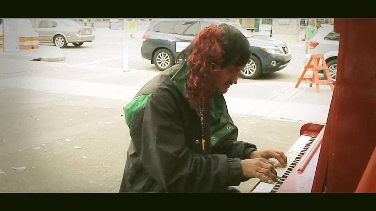 man play piano and sing a sad song on the street 2