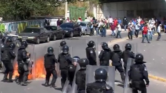 Protesters attack police as anger boils in Mexico over 43 missing students