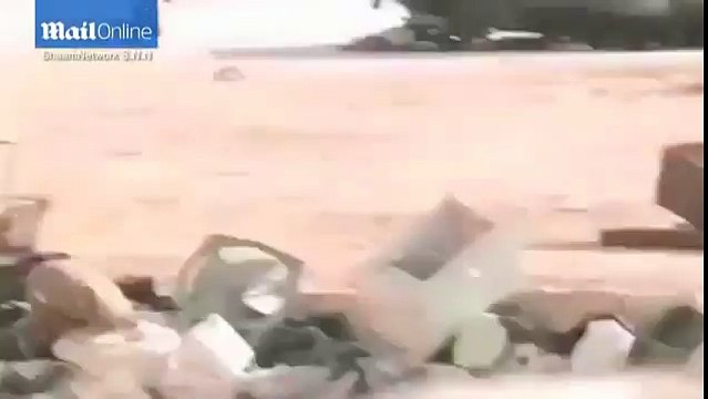 The incredible moment Syrian boy 'fakes death' to save girl