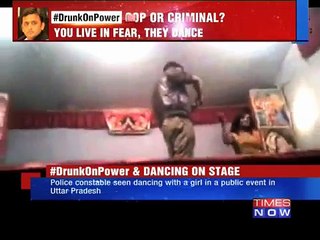 Police man with dancing girl in India