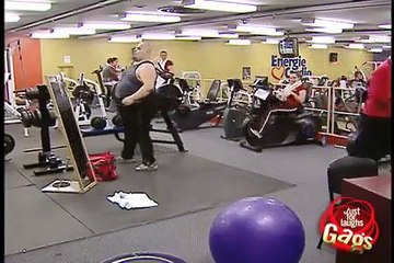 healthy man taking exercise in gym very funny video.