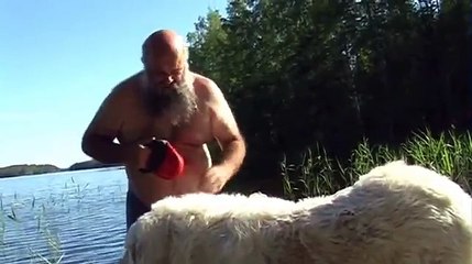 Old Man Trying To Get His Dog To Take A Swimming
