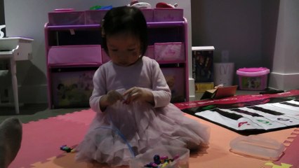 Girl Stringing Beads