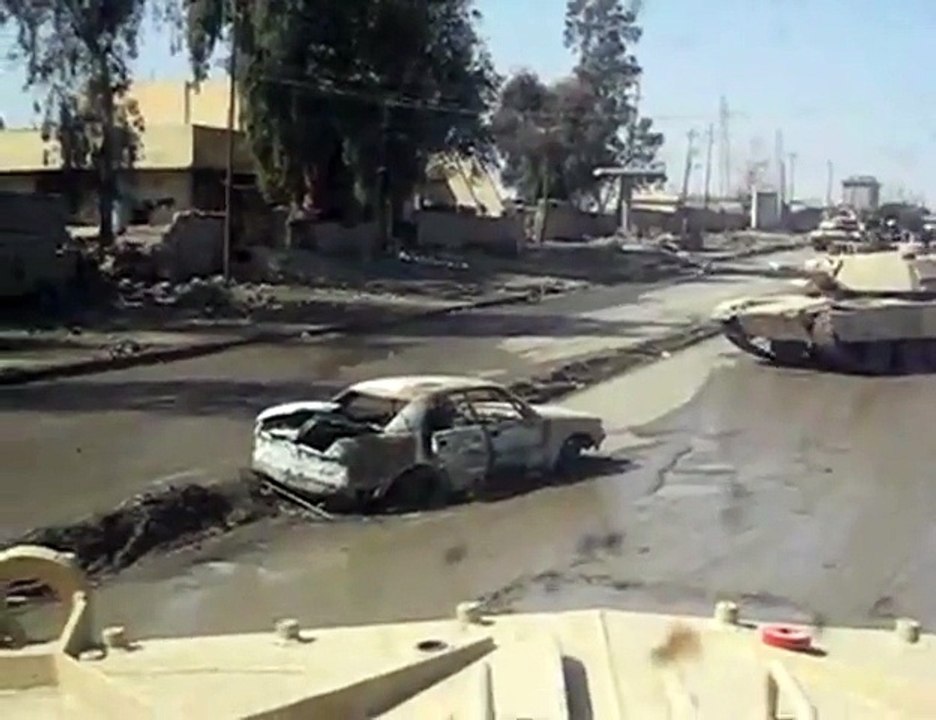 Tank Rolls Over Bomb