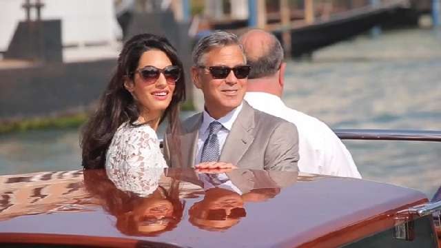 George and Amal Clooney Looking to Adopt