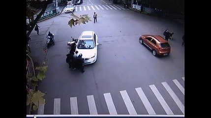 Good Samaritans lift car off woman trapped under wheels after accident