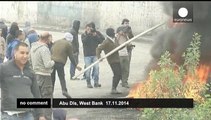 Palestinian protesters clash with Israeli police at security barrier