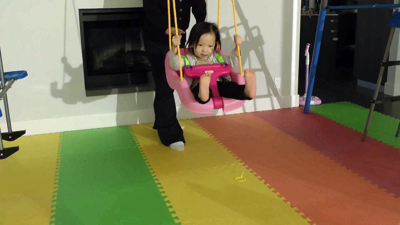 Girl Playing Swing