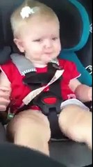 funny baby dancing in a car