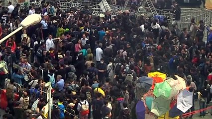 Hong Kong protesters smash into government building