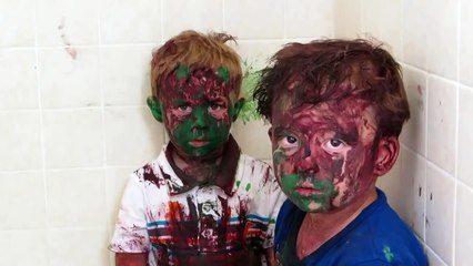 Kids play with paint a get it all over their faces