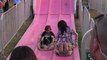 Kourtney Kardashian goes down slide with son Mason as Scott Disick looks on in The Hamptons