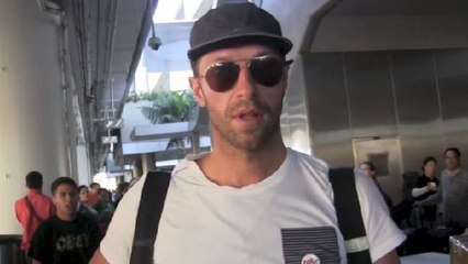 Chris Martin Spreads The Love At Airport