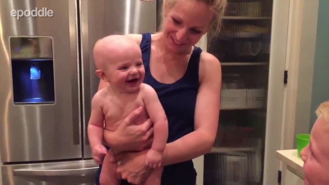 Baby adorably belly laughs at older brother