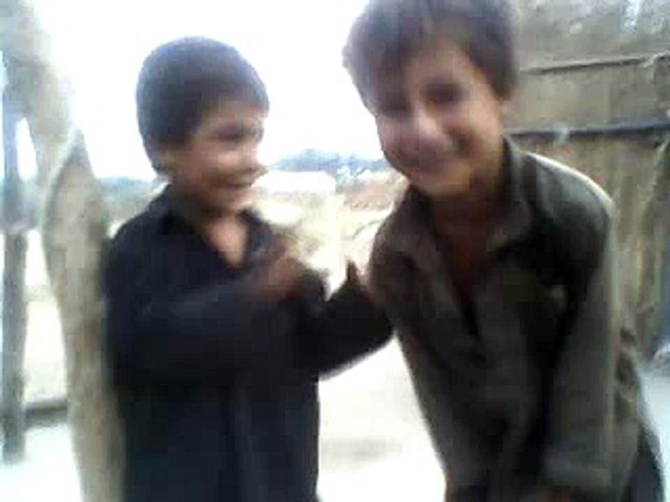 Cute afghani kids fighting