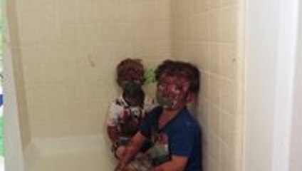 Kids play with paint and get it all over their faces