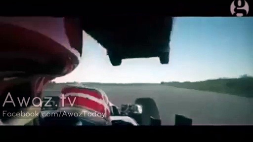 Giant truck jumps over Formula One car