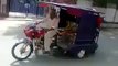 Dunya News-Chingchi Rickshaw Doing One Wheeling