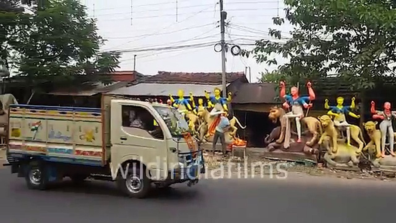How Indian Potter Making Painting On Idol Of Goddess jagadhatri Roadside - wildindiafilms