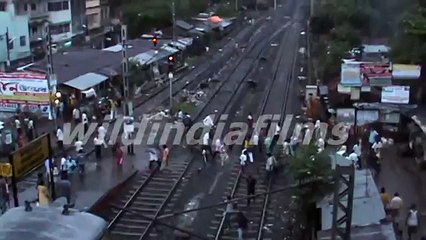 In third world country the men and women crosses the railway track by taking life in his mouth.