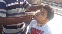 Roadside dentist works his magic on Rail station, Odd Jobs in India - wildindiafilms