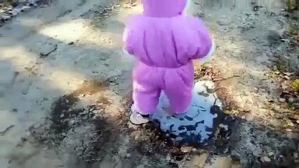 Funny baby playing, see what's happening on the ice.