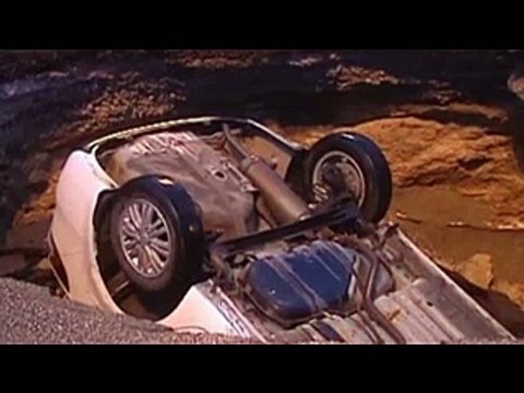 Chinese motorist drives car into sinkhole