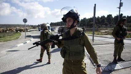 Palestinian woman shot after knife attack
