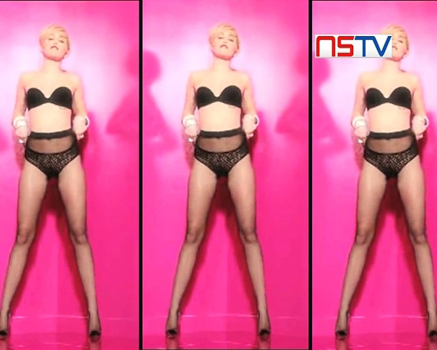 Miley Cyrus goes topless