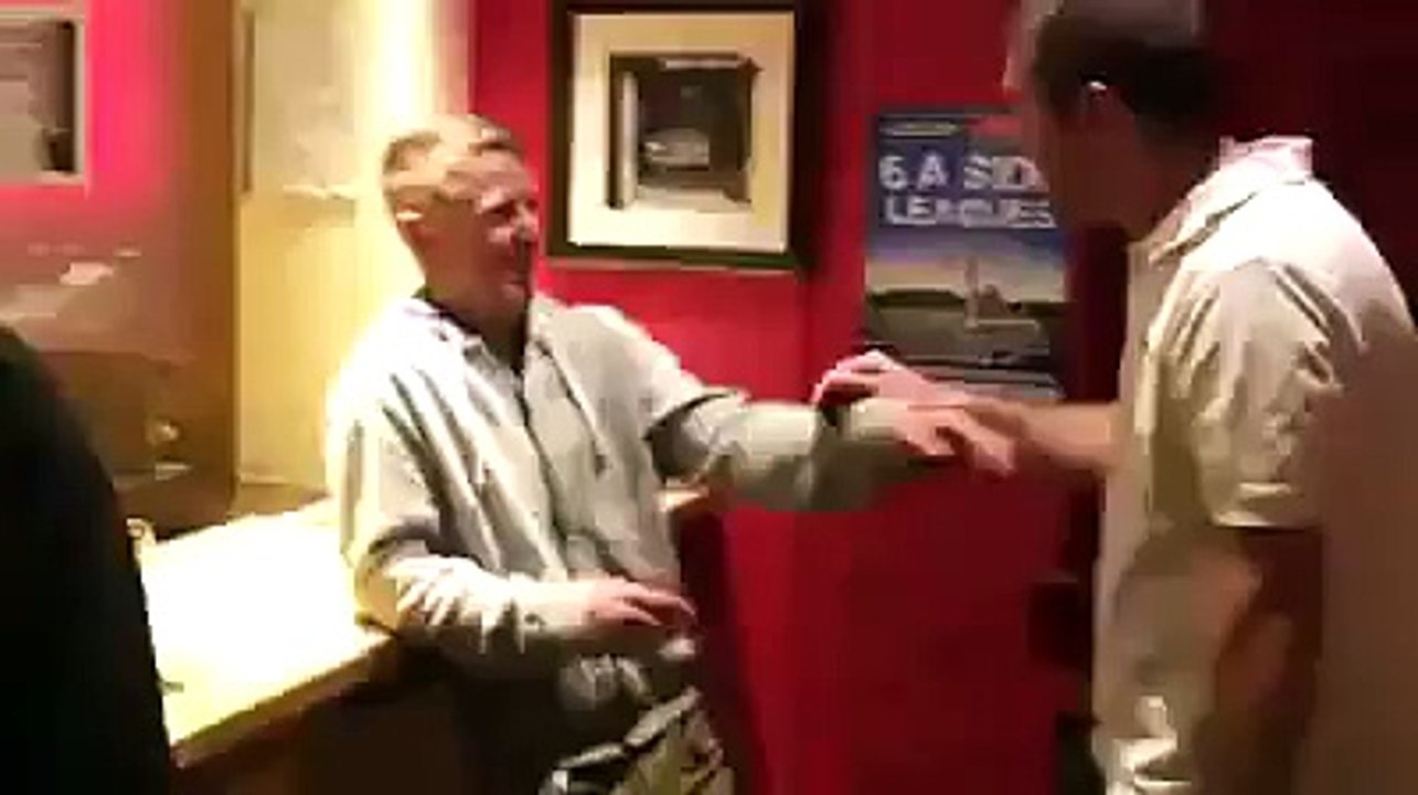 Guy falls through bar
