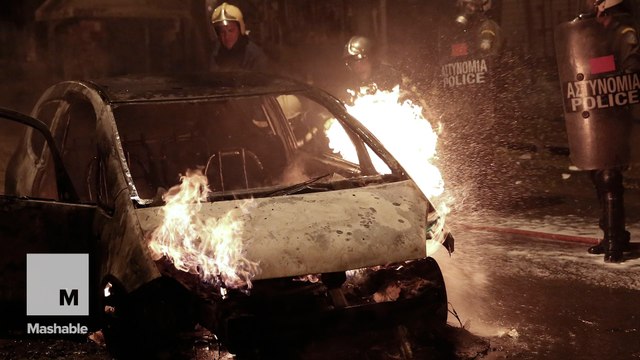 Greek anarchists torch cars, clash with Athens police