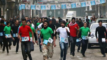 Runners race through rubble in war-torn city of Aleppo
