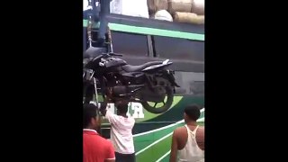 Super Human Carries a Bike Over His Head
